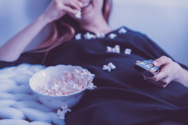 woman watching tv series